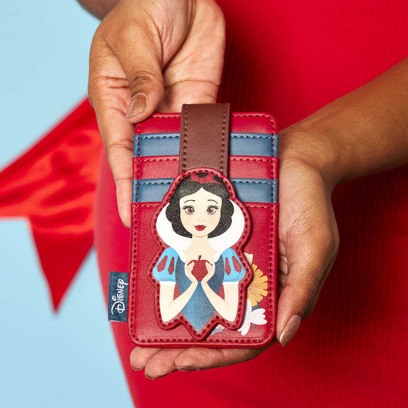 Woman's hands holding the Loungefly Snow White Classic Apple Card Holder, featuring Snow White holding an apple with four card slots above her.